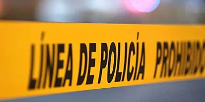 Tiran cadáver embolsado y con mensaje junto a taller mecánico en Chietla